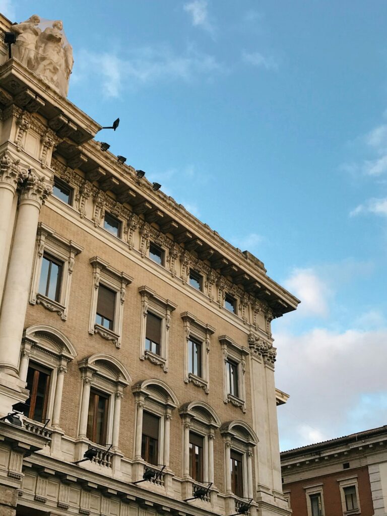 beige concrete building under blue sky during daytime