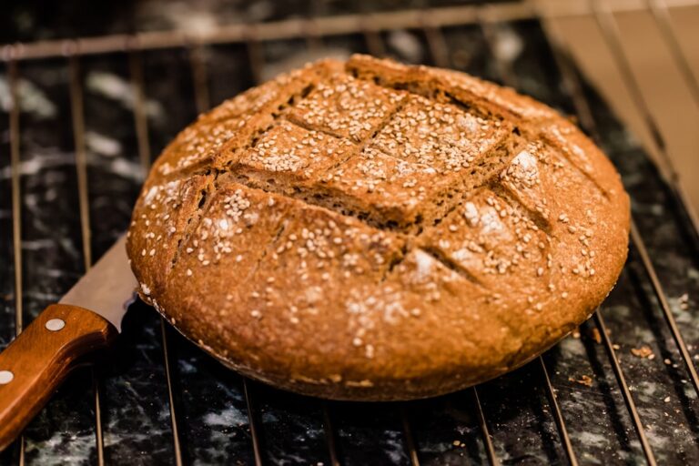 A loaf of homemade whole grain sourdough bread fresh from the oven