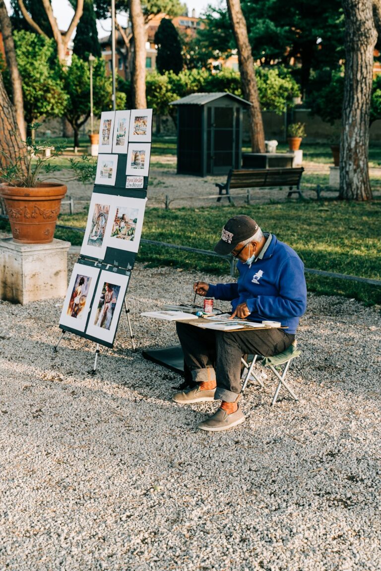 Street artist painting scenes of Rome, Italy