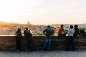 People enjoying the view from the Giardino degli Aranci in Rome, Italy