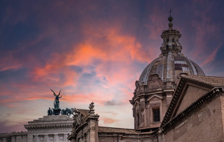 a building with a dome and a statue on top of it