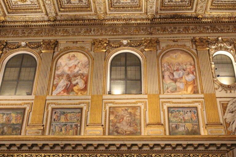 a wall with paintings on it in a building