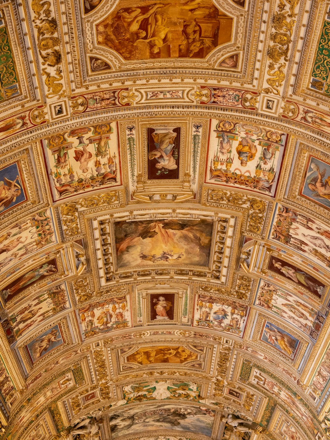 the ceiling of a building with paintings on it