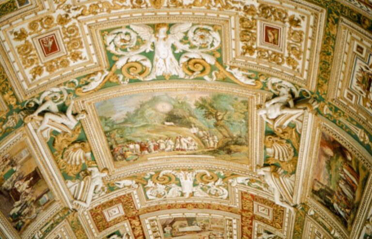 the ceiling of a building with paintings on it