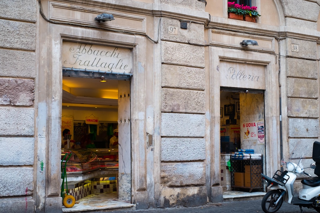 a store front with a motorcycle parked in front