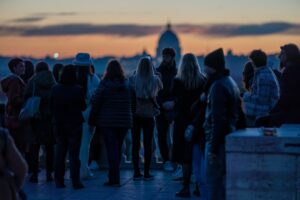 People gathering to watch the sunset in Rome, Italy from the Pincio.