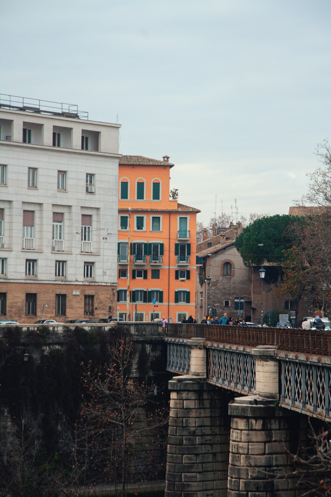 a bridge with a building in the background