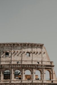 an old building with a clock on the side of it