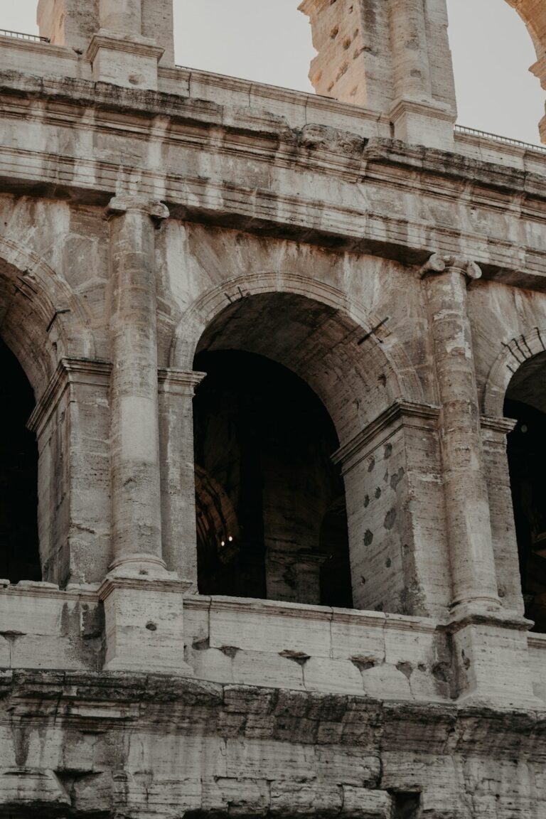 an old building with arches and a clock tower