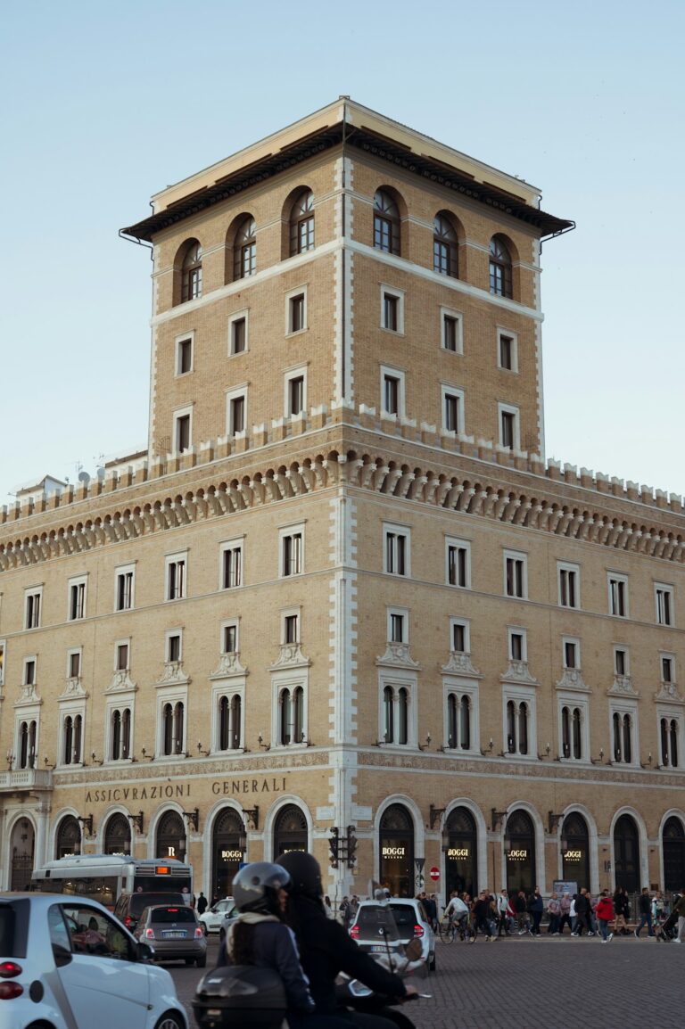 a motorcycle parked in front of a tall building