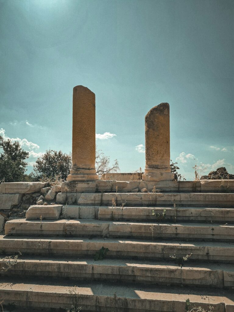 a couple of stone pillars sitting next to each other