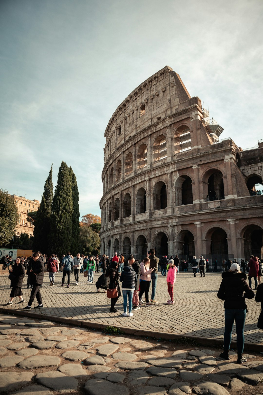 a group of people standing around a building