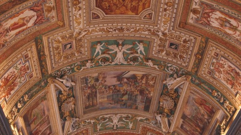 the ceiling of a building with paintings on it