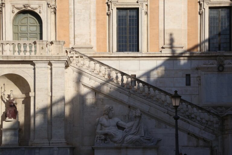 a building with a statue of a woman on the outside of it