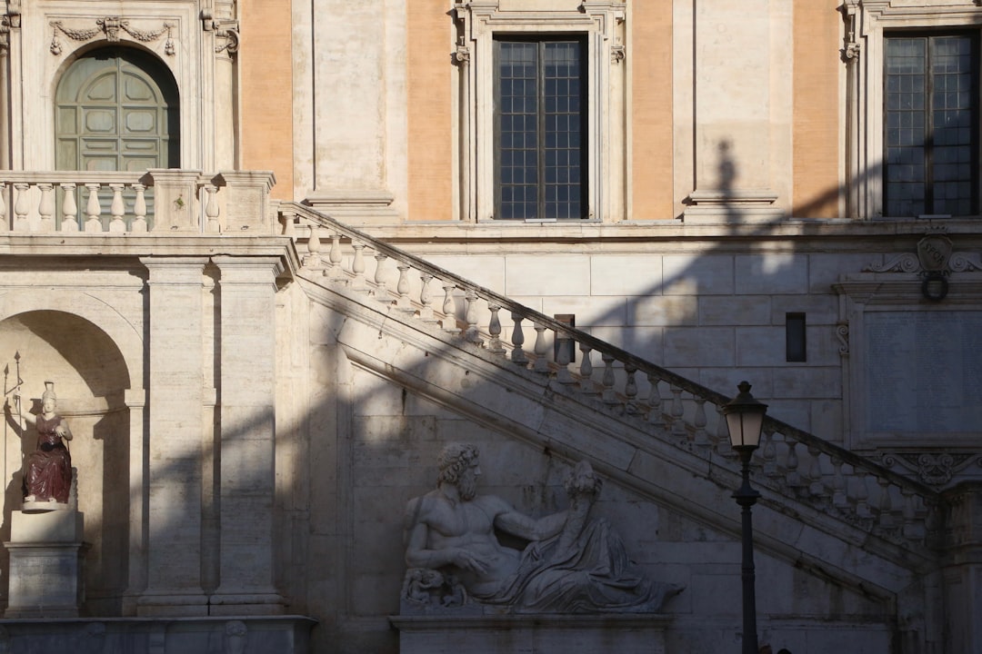 a building with a statue of a woman on the outside of it