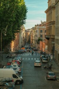 a city street filled with lots of parked cars