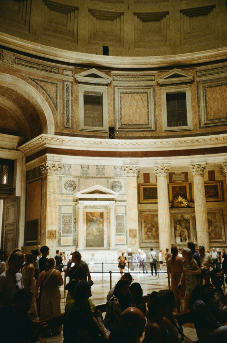 A group of people standing in a large room
