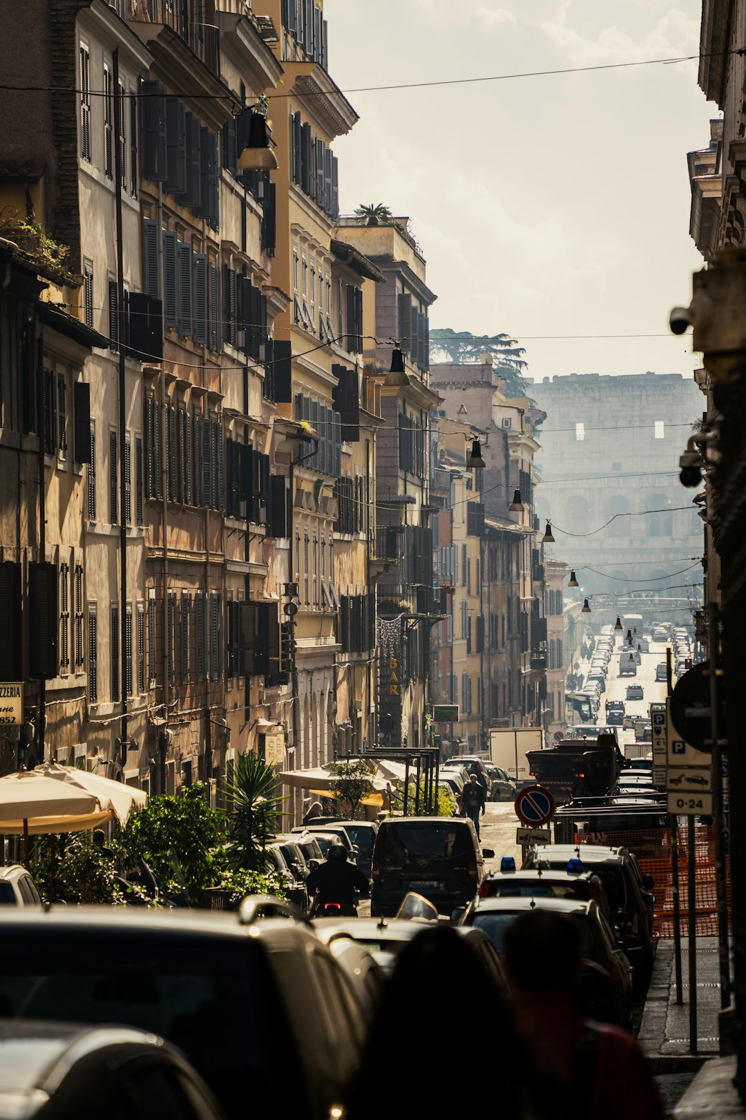 Golden sunlight shining on a street in Rome.