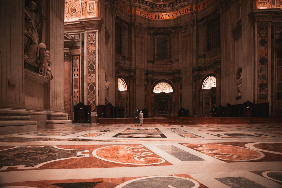 A person standing in a large room with a ceiling